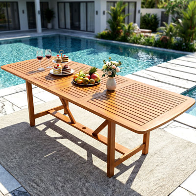  Extendable Rectangular Outdoor Dining Table with 2” Umbrella Hole, 95”W Solid Eucalyptus Wood Patio, UV Resistant Tables, Compact from 6-8 Chairs - Natural Finish.