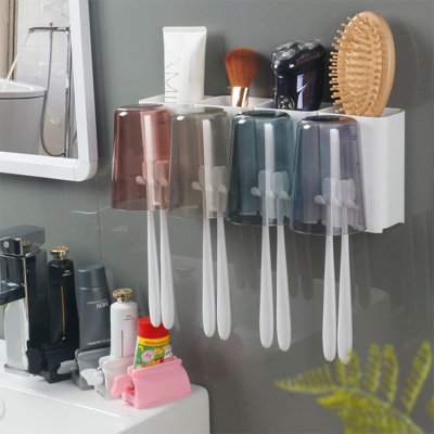 Toothbrush Holders And Toothpaste Squeezer Set - Wall Mounted Bathroom Accessories With 4 Cups Toothbrush Holder And Toothpaste Dispenser -  Rebrilliant, E67382FF1CD34850BFEE6155CD2D494A