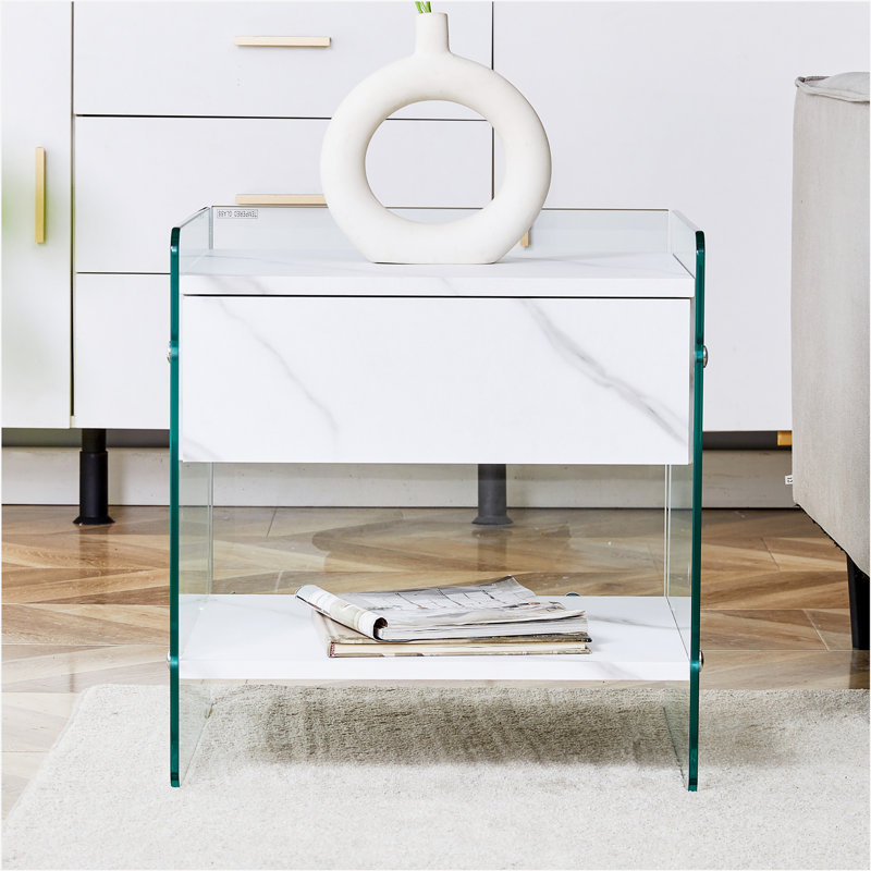 Bedside table with drawers. The board surface is MDF with white grain sticker, and both sides are transparent tempered glass. The design is simple and elegant, with excellent storage functions.