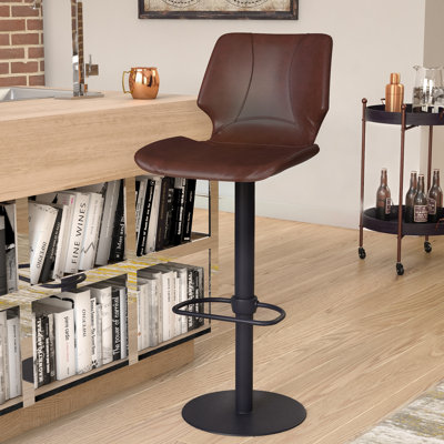 Kadejiah Swivel Adjustable Height Barstool with Footrest in Faux Leather, and Metal by Latitude Run