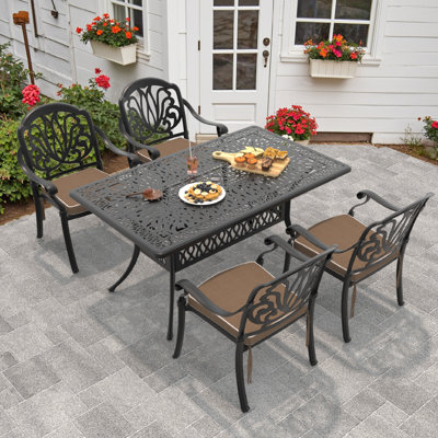 Atziry 4 - Person Patio Dining Set with Rectangular Table , Brown Cushions Included