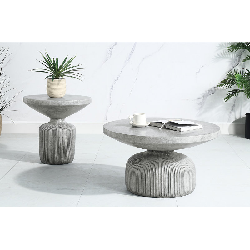 Table basse en ciment avec surface ronde grise patinée et base de piédestal stable