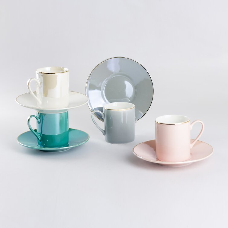 Set of four gold-plated porcelain espresso cups and saucers