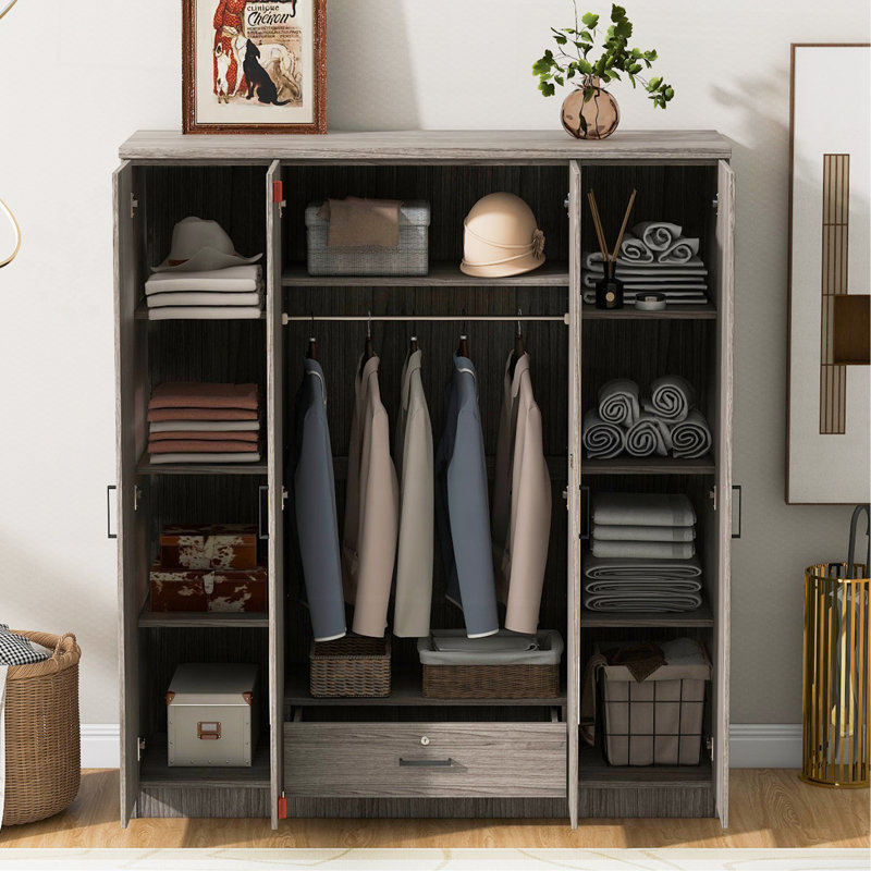 Armoire spacieuse à quatre portes avec miroir intégré et rangement sécuritaire, parfaite pour une chambre organisée