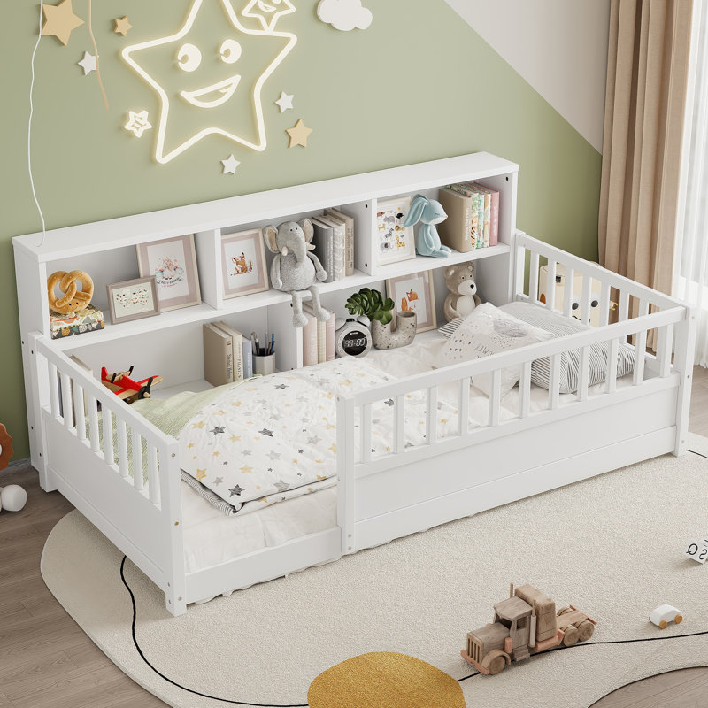 A twin-sized wooden floor bed with a fence-style guardrail, side storage decorative function, and the color is white, Twin