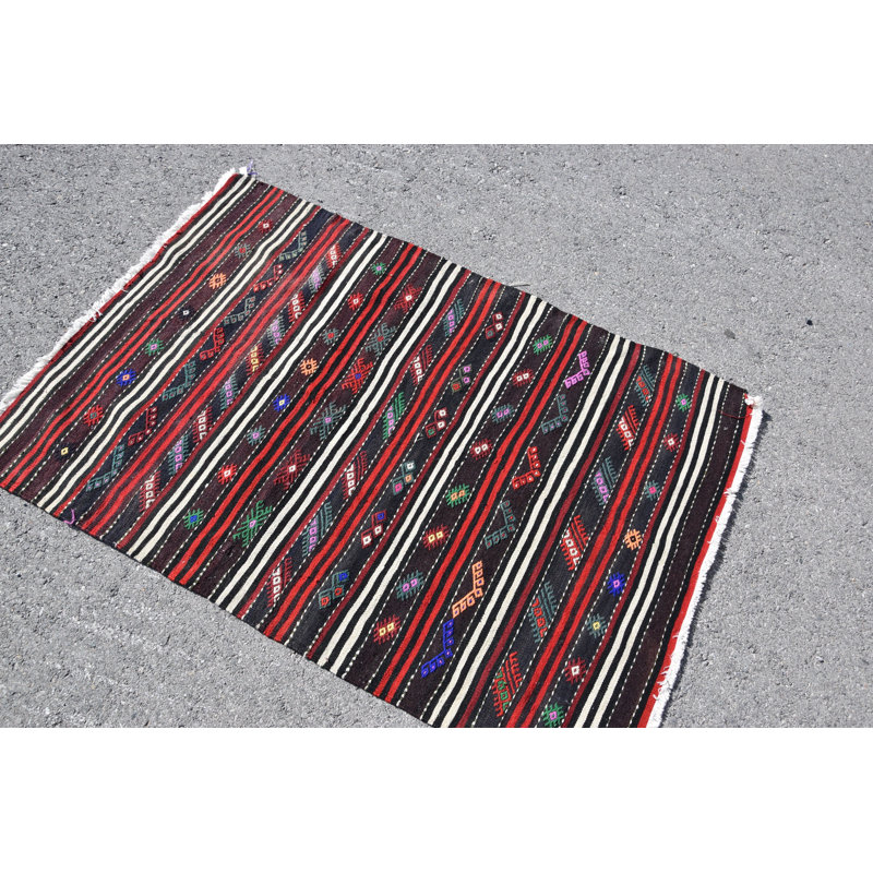 Tapis traditionnel turc en laine avec des rayures géométriques complexes multicolores pour un décor bohème