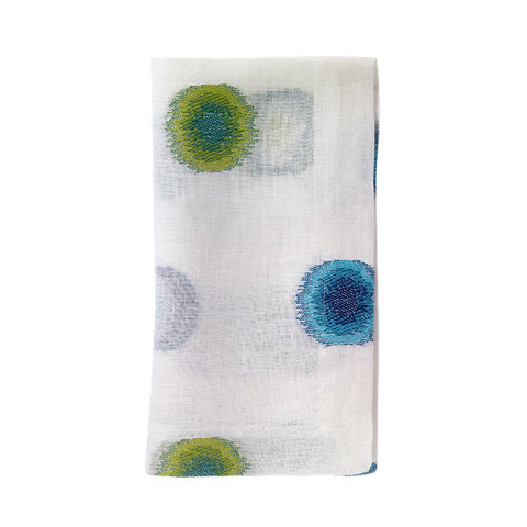 White napkin with green, blue, and purple circles.