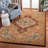 Ezell Hand Tufted Wool/Cotton/Latex Floral Rug in Rust-16768922