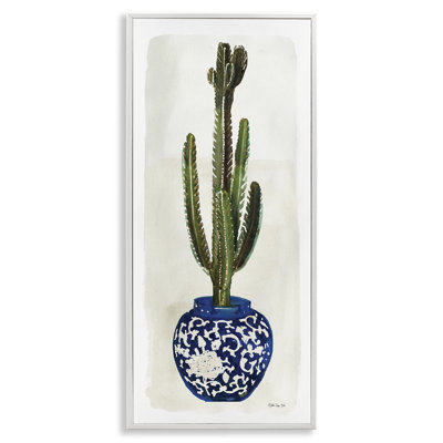 Cactus dans un vase orné de plantes bleues