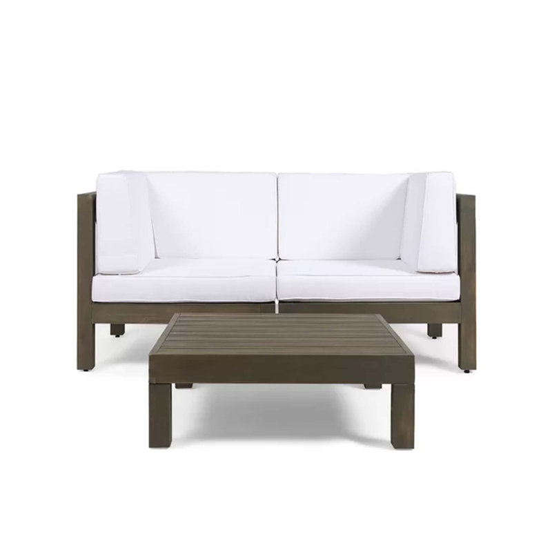 Causeuse modulaire à deux places modulaire à dossier en X avec table basse assortie pour les espaces de vie extérieurs avec structure en bois d'acacia durable et coussins résistants aux intempéries.