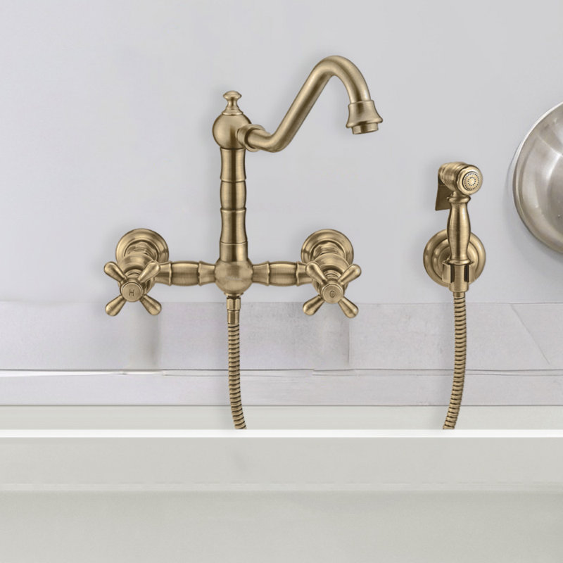Whitehaus Wall Mount Faucet with Long Traditional Swivel Spout and Solid Brass Side Spray, Antique Brass, Cross