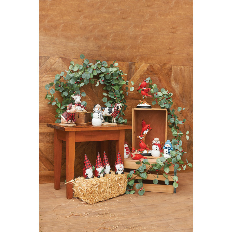Figurine bonhomme de neige avec oiseau