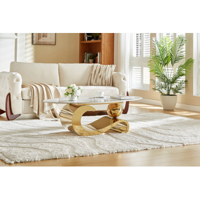Table basse en métal doré avec piédestal en acier inoxydable et plateau en faux marbre, base dorée