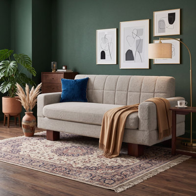 Canapé rembourré avec dossier capitonné, accoudoirs carrés et siège à coussin épais pour le salon ou un appartement