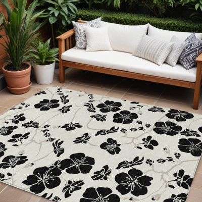 Tapis extérieur lavable floral ivoire et noir 9 pi x 12 pi