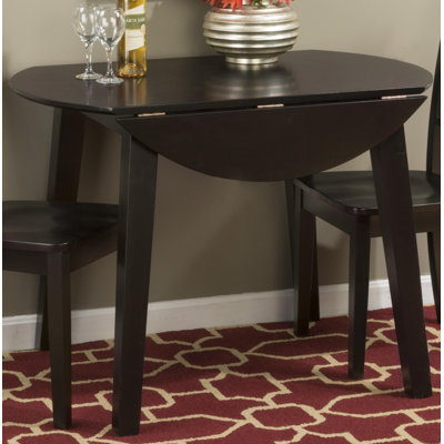 Iyad Extendable Round Solid Wood Dining Table