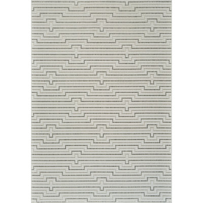 6' X 9' Cream and Beige Geometric Distressed Indoor Outdoor Area Rug