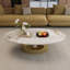 Table basse ovale imitation marbre, 125 x 68 x 39 cm, dessus en pierre frittée, finition blanche et dorée