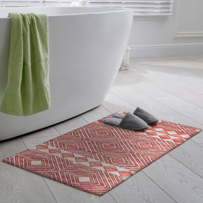 Tapis géométrique rouge / blanc tissé à la machine