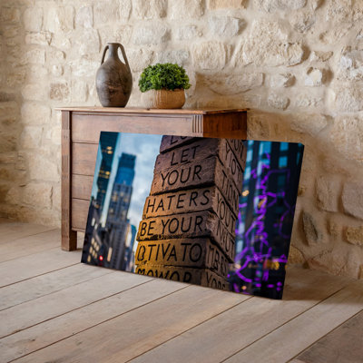 Canvas A Towering Stack Of Textured Stone Blocks Each Intricately Carved Wall Art With Bold Impactful Lettering That Reads LET YOUR Canvas Wall Art