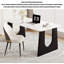 Table de salle à manger élégante et luxueuse avec plateau en pierre frittée et pieds évidés-848484884