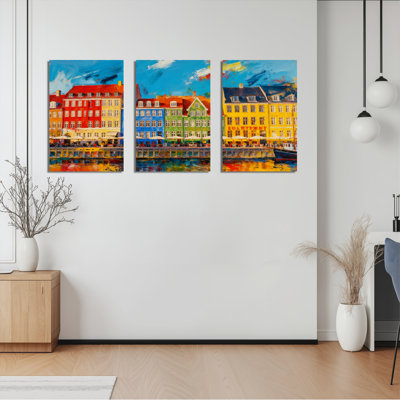 Ensemble de 3 tableaux sur toile représentant des maisons colorées au bord du canal