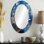 Orange géométrique orange et bleu III - Grand miroir mural ovale sur métal