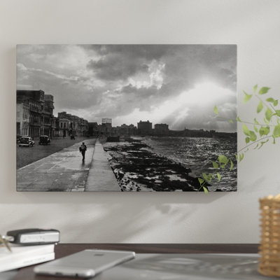 1930s-1940s Anonymous Silhouetted Man Walking Along Havana Sea Wall At Sunset Cuba by Vintage Images - Print