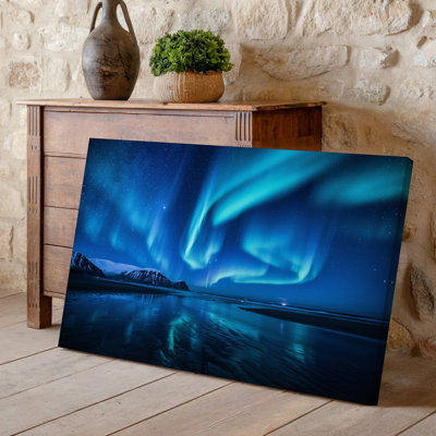 Canvas A Breathtaking Nighttime Scene Showcasing The Mesmerizing Northern Lights Swirling Wall Art In Vibrant Shades Of Green And Blue Canvas Wall Art