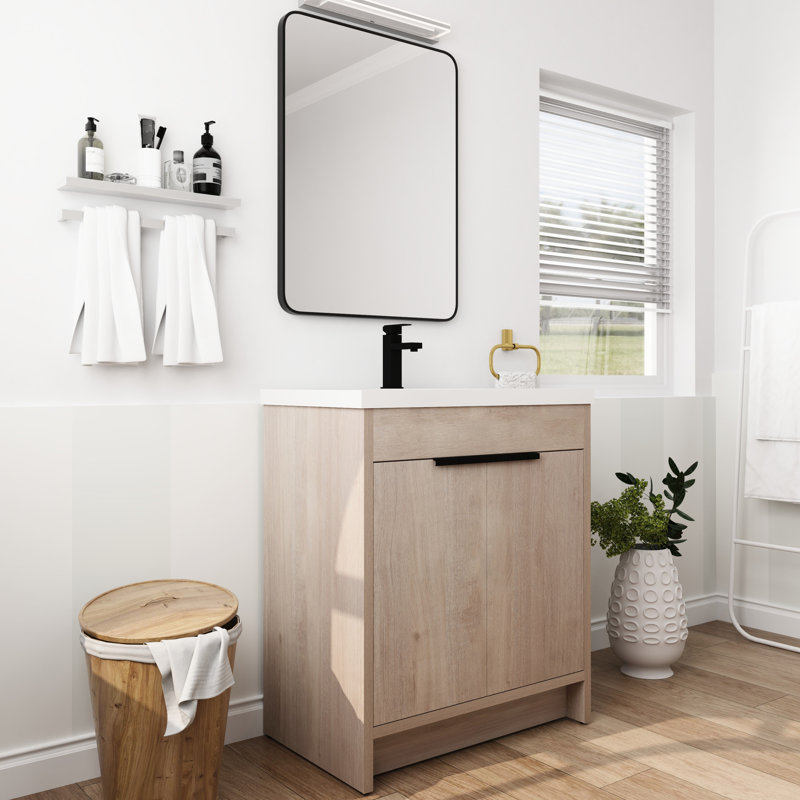 Meuble-lavabo autoportant de 30 po avec lavabo en résine. 2 portes à fermeture en douceur, tablette ajustable. Matériau en contreplaqué, poignées en métal. Lavabo blanc en chêne uni avec installation. Portes autoportantes de 30 po.