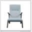 Fauteuil capitonné en tissu bleu clair avec rembourrage confortable et design élégant pour une utilisation polyvalente à la maison