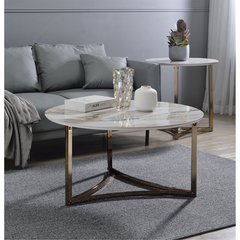 Table basse, plateau en pierre frittée et finition champagne