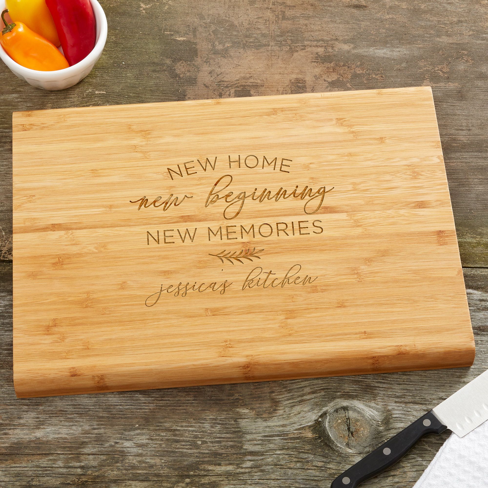 https://assets.wfcdn.com/im/51015757/compr-r85/1984/198450095/new-home-new-memories-personalized-bamboo-cutting-board.jpg