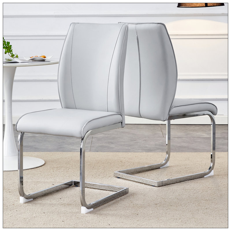 Chaise de luxe arquée simple - ensemble de 2 chaises de salle à manger en polyuréthane à haute résilience avec pattes arquées en métal argenté.