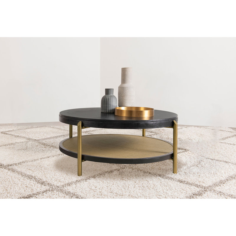 Table basse autoportante ronde noire avec tablette de rangement et pieds en laiton vieilli