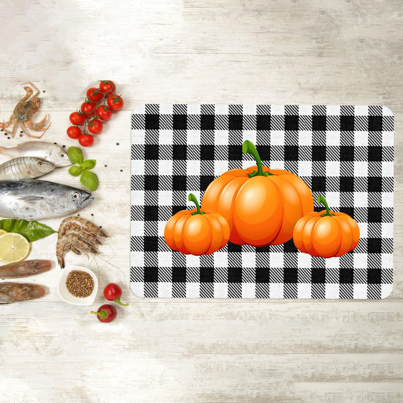 Planche à découper Spooky sur le thème d'Halloween avec une conception de citrouille frappante, parfaite pour la décoration automnale et les réceptions