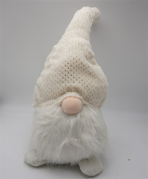 Gnome en tissu crème blanc flou