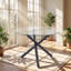 Table de salle à manger EGO, plateau en verre trempé, structure en métal noir, dimensions : 110 cm (L) x 110 cm (P) x 74 cm (H).