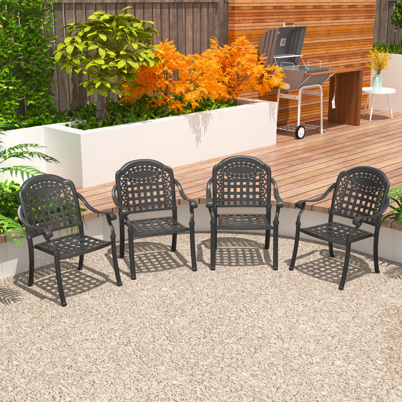 Ensemble de 4 chaises de jardin empilables avec accoudoirs, coussins bleus et structure en aluminium moulé.