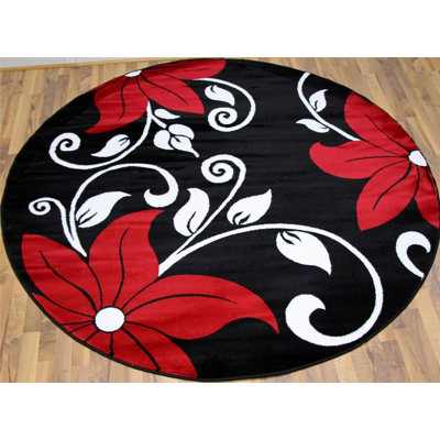 Tapis rouge / noir à motif floral