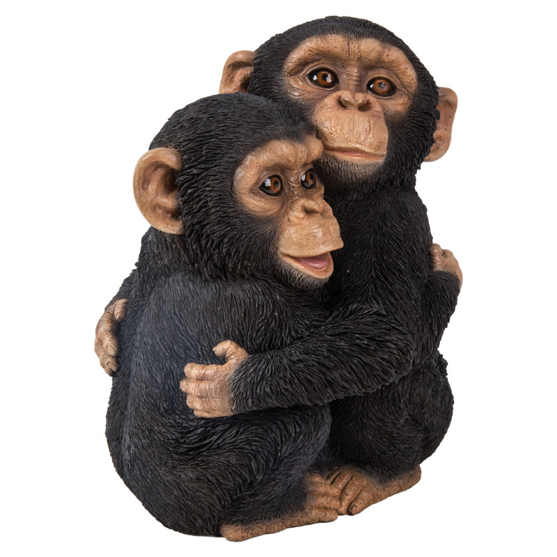 Chimpanzees Hugging Statue