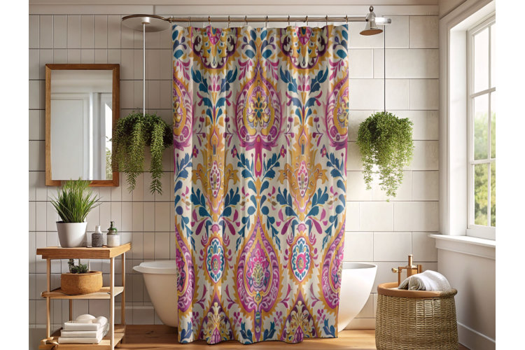 Colorful boho shower curtain in front of a bathtub with hanging plants on either side