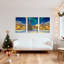 Ensemble de 3 tableaux sur toile représentant un village de Noël avec aurores boréales et sapin.-121088947