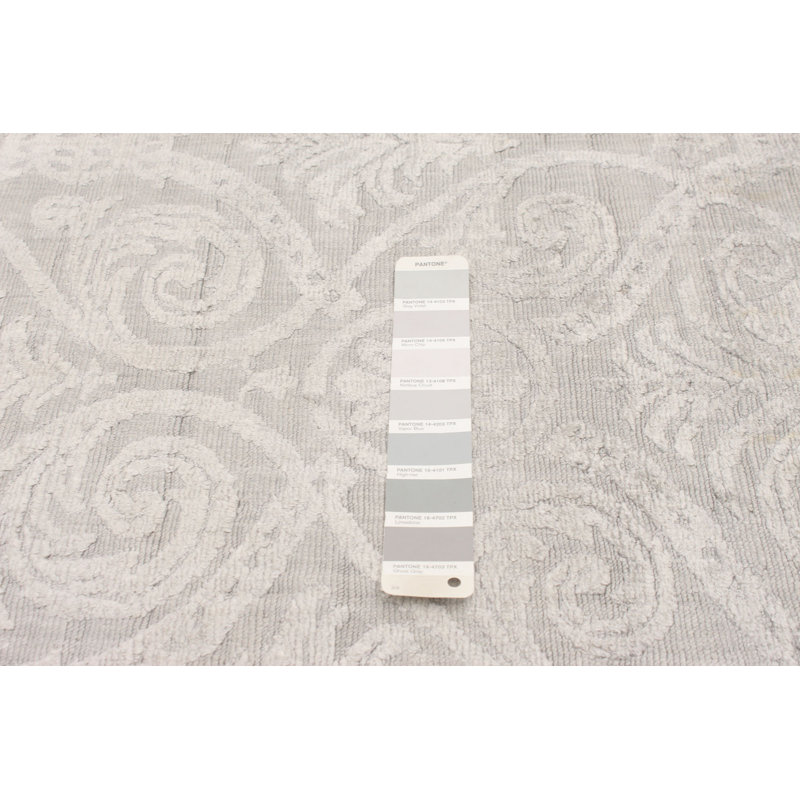 Tapis géométrique beige tissé à la main