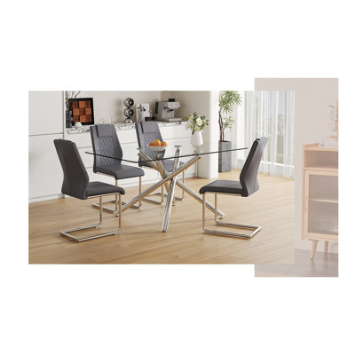 Ensemble de table à manger moderne en verre trempé luxueux avec chaises en polyuréthane, pieds en métal argenté, mobilier de cuisine contemporain