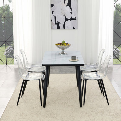 Table and Chair Set.White imitation marble texture glass top + lower black MDF board,black metal legs.Paired with 4 Transparent Plastic Chairs with Black Metal Legs.Bring a comfortable home experience