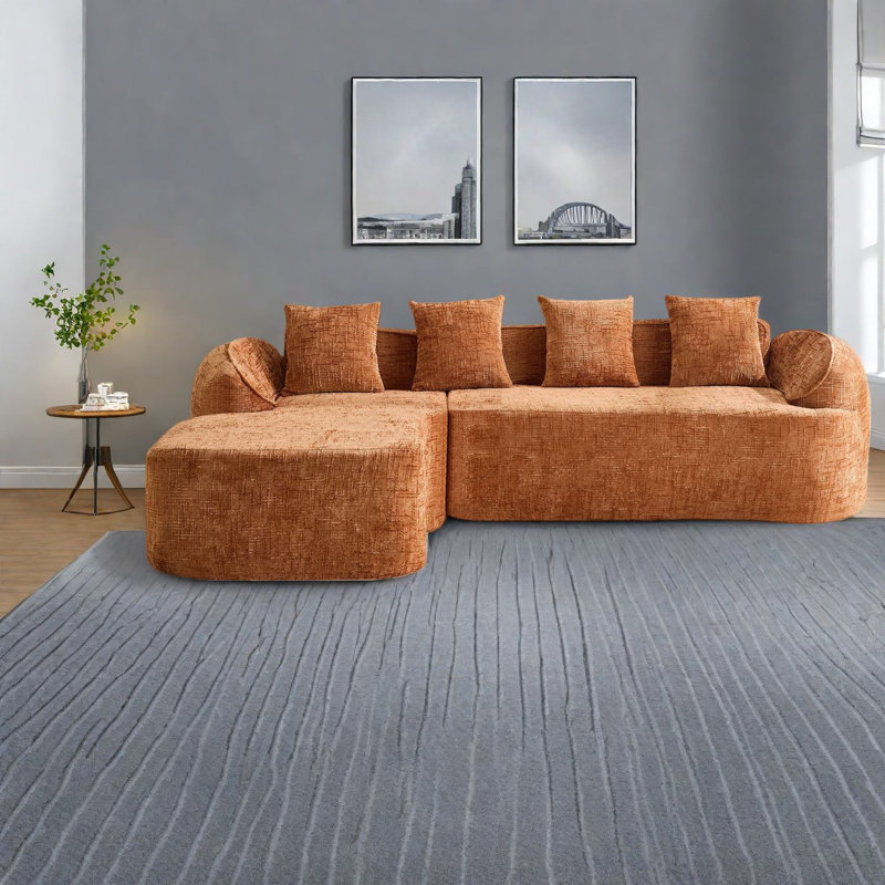 Canapé en L en chenille orange avec accoudoirs courbés et peu encombrant