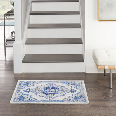 Tapis ivoire / bleu en polypropylène tissé à la machine Ikat