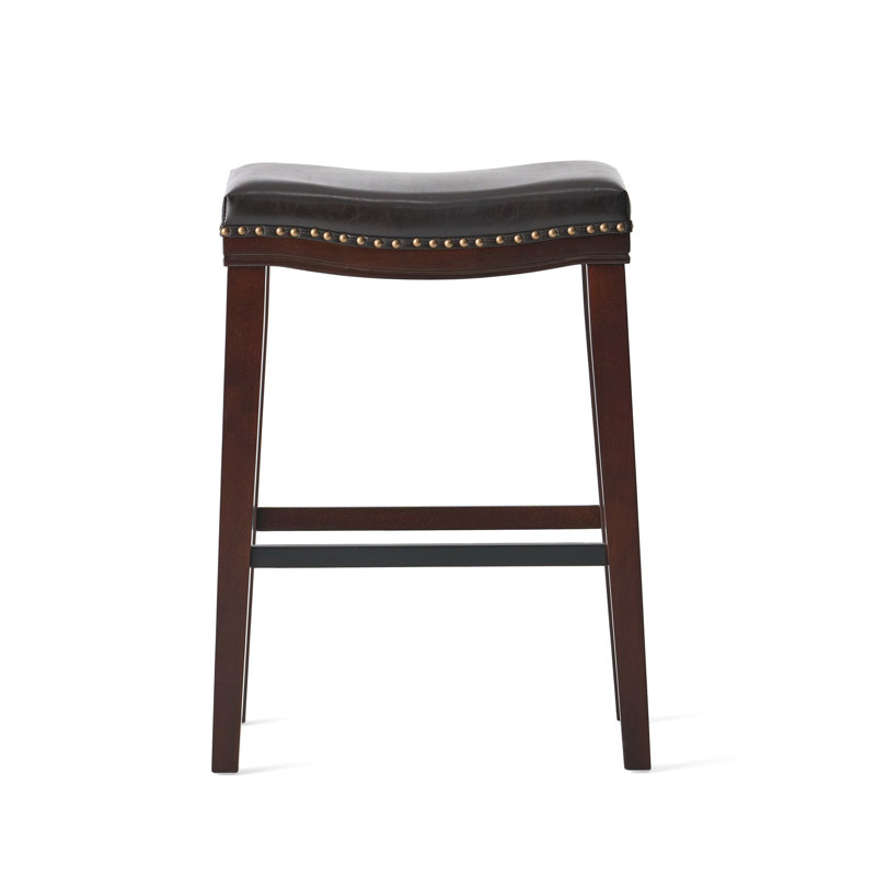 Tabouret brun en cuir brun, soutenu par un bois d'hévéa stable, rehaussé d'une fabrication robuste