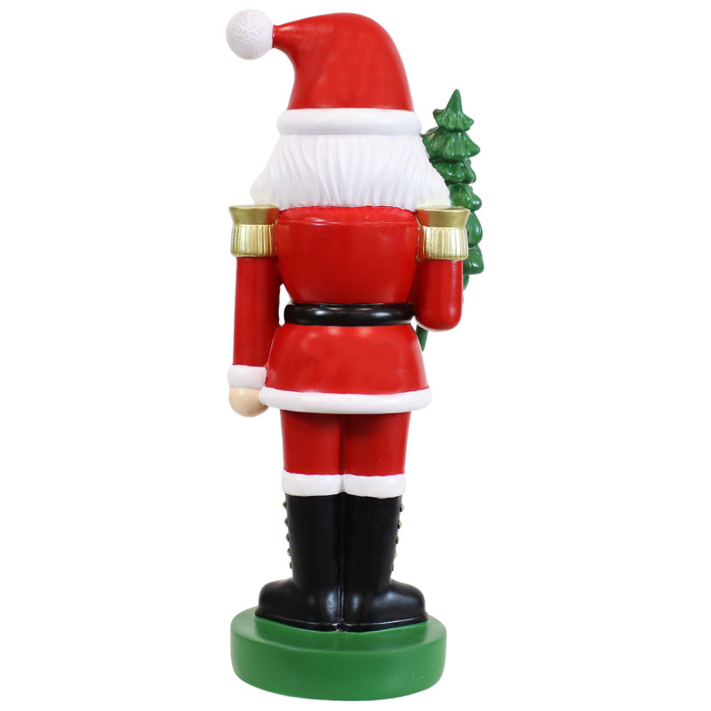 Statue de père Noël avec arbre et casse-noisette d'intérieur